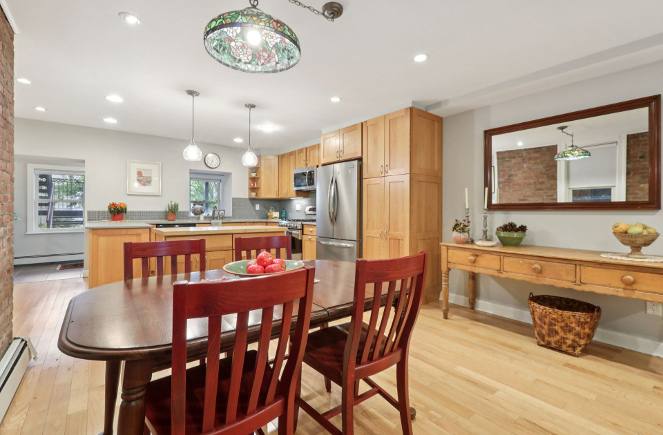 Staged open-concept kitchen and dining area